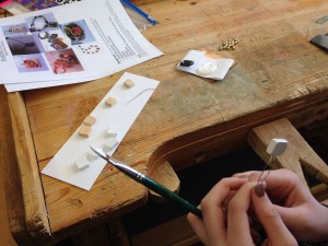 Using the fork to paint the tiles