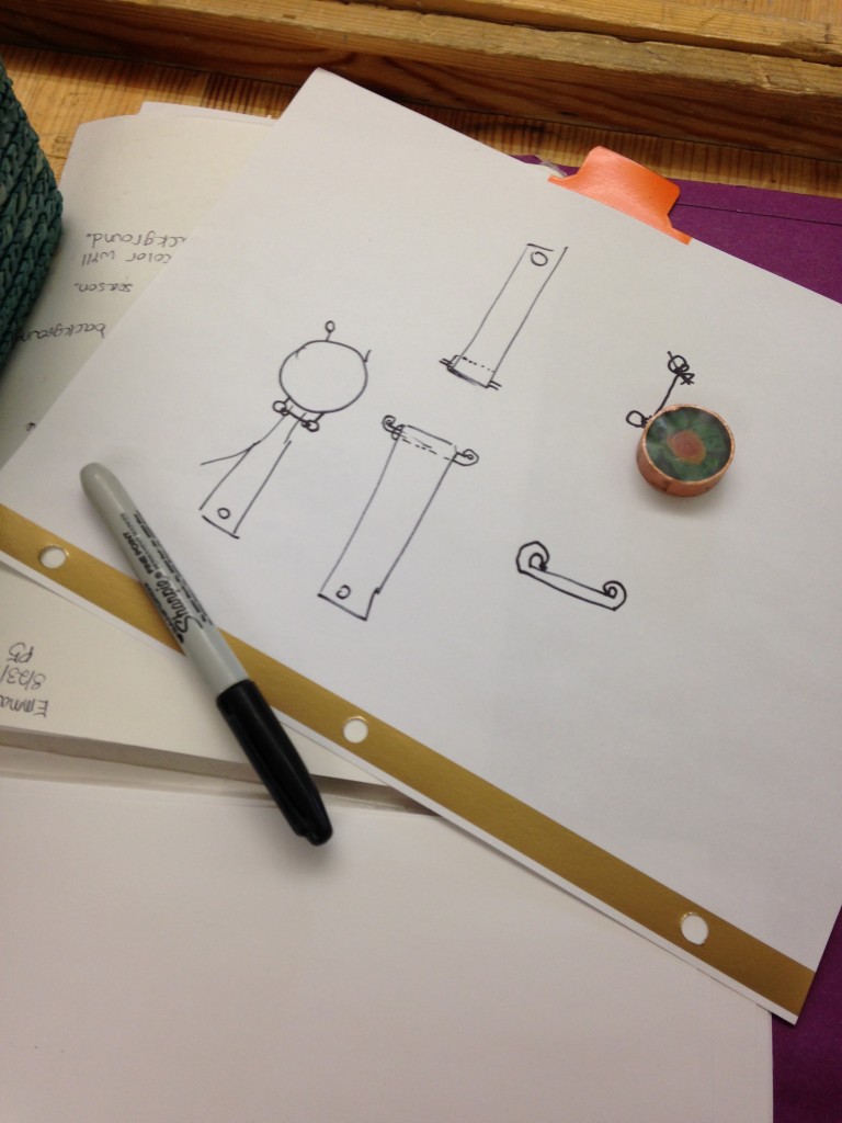 Emma's sketch for her shrine watch. She is demonstrating critical thinking as she figures out how to attach the shrine housing to the strap.