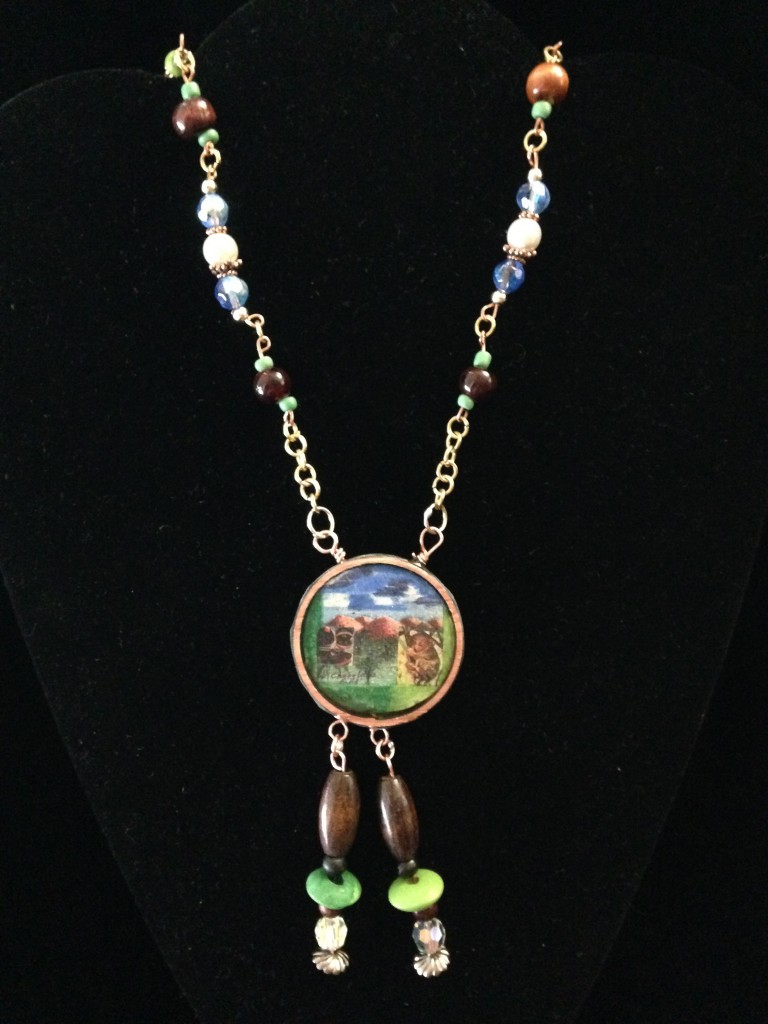 Chocolate Hills mixed media image as the focal point of necklace